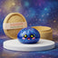 Studio photo of the galaxy dumpling squishy with bamboo steamer