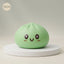 Jumbo large green dumpling squishy on a display podium
