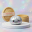Studio photo of the rare silver dumpling squishy with bamboo steamer