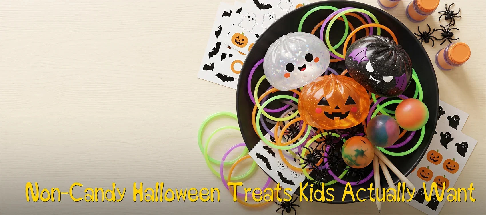 Bowl of non-candy Halloween treats with dumpling squishies, glow bracelets, stickers and spider rings