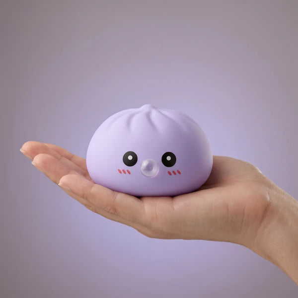 Blue blow dumpling squishy held in hand