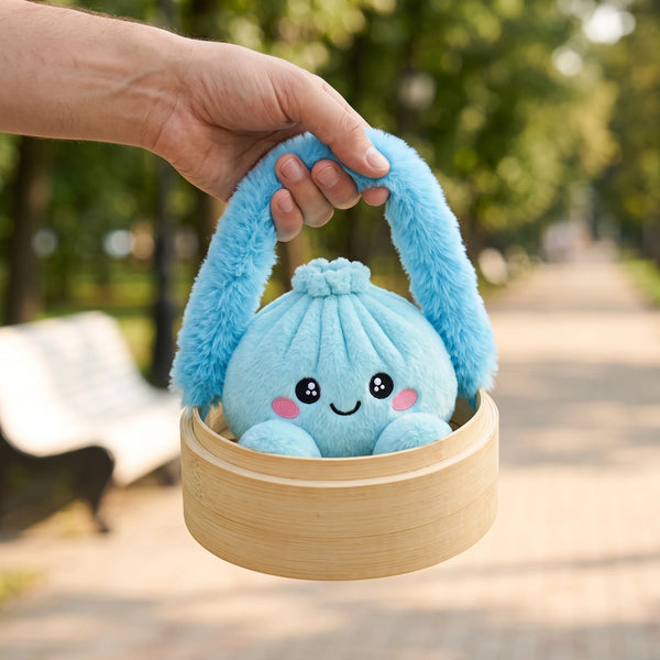 Hand carrying the Sky Blue Dumpling Squishy Plush in its steamer case by the fluffy handle