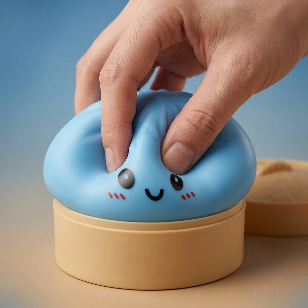 Blue dumpling squishy being squeezed showing slow rising foam