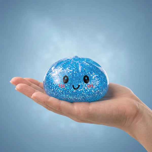 Hand holding a soft blue glitter dumpling squishy