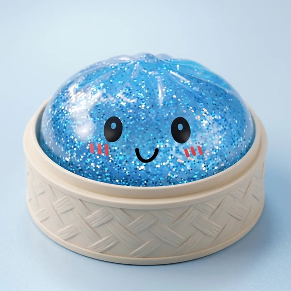 Blue glitter dumpling squishy inside its bamboo steamer box