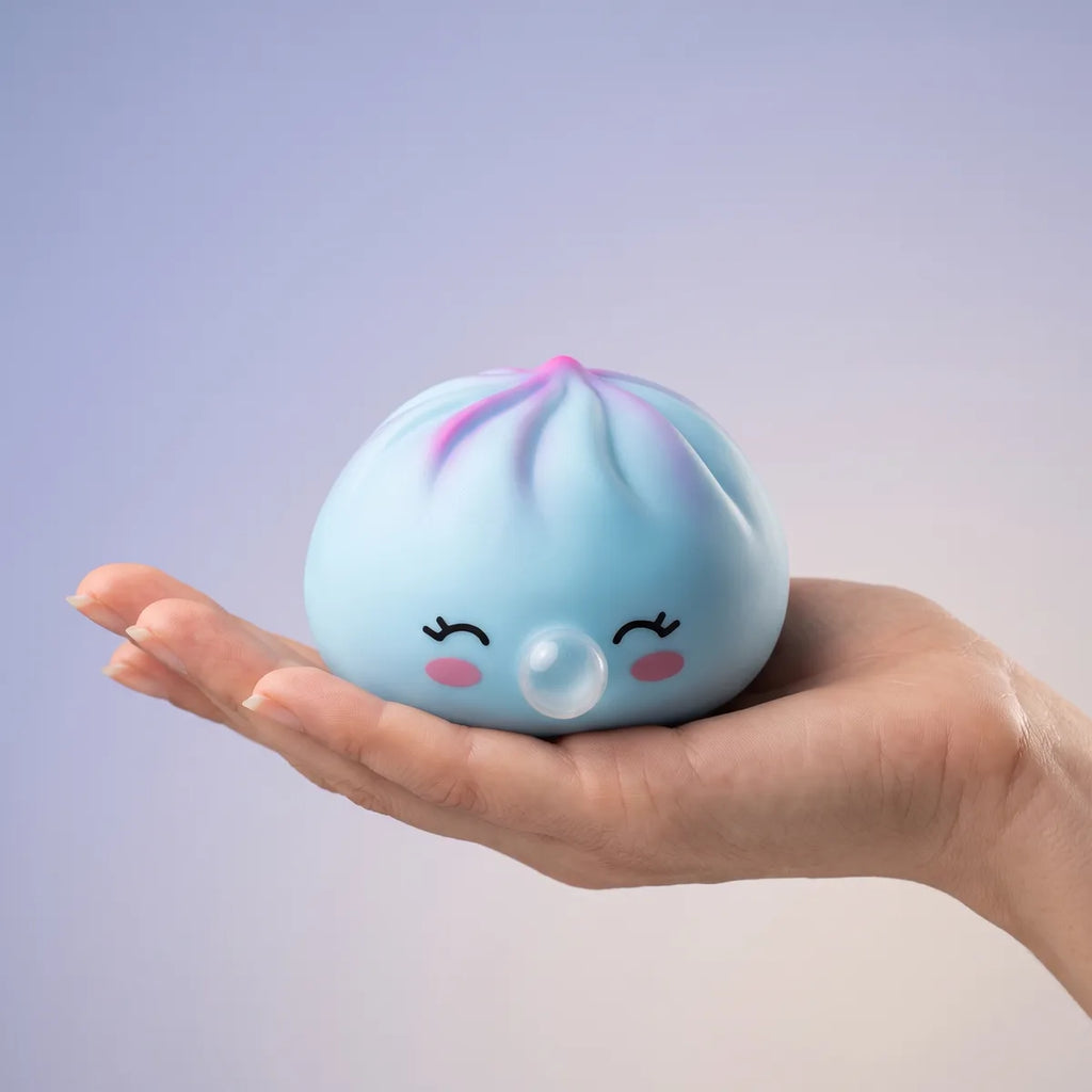 Blue rare blow dumpling squishy in a premium lifestyle setting