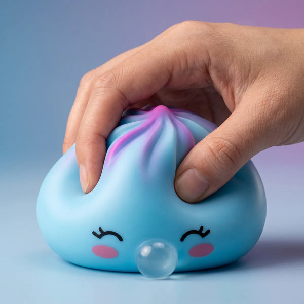 Hand squeezing a blue rare blow dumpling squishy