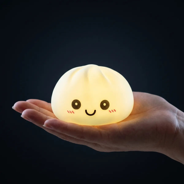 Blue squishy dumpling light held in hand