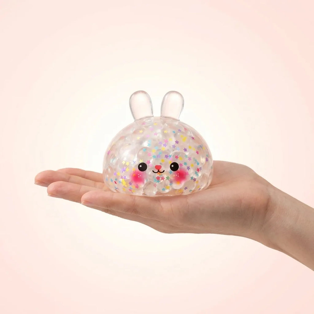 Hoppy Bunny Bubble Dumpling Squishy resting on an open palm to show its real size