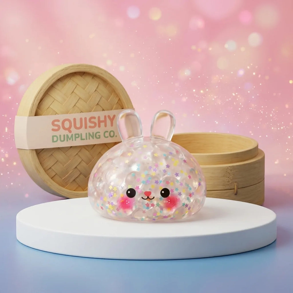 Hoppy Bunny Bubble Dumpling Squishy on a white studio podium beside a steamer basket