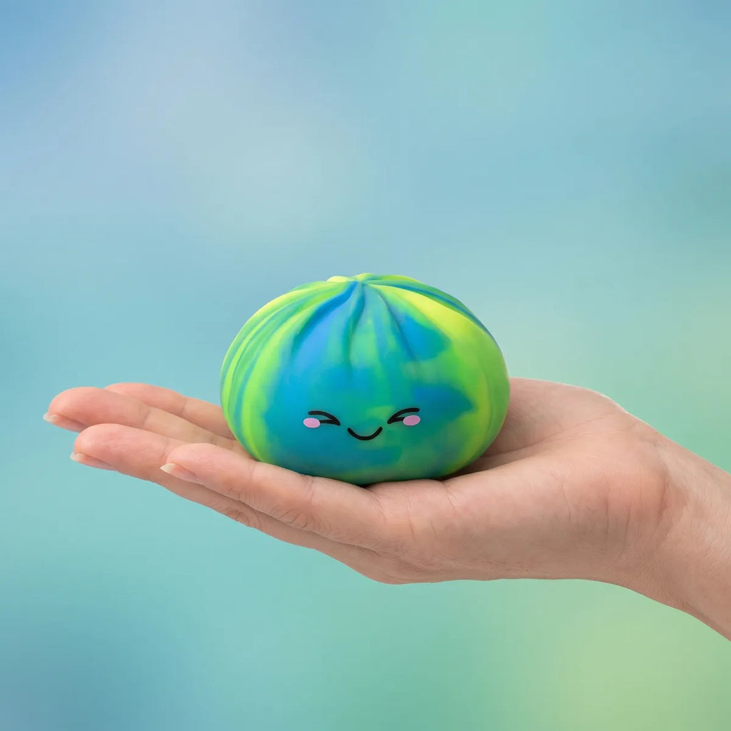 Colorful dumpling squishy held in hand lifestyle shot
