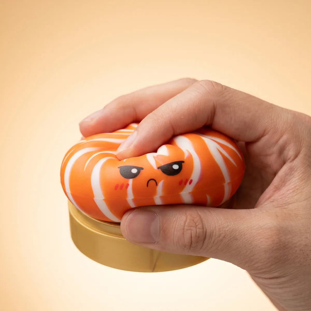 Hands playing with the dumpling squishy bun mystery toy