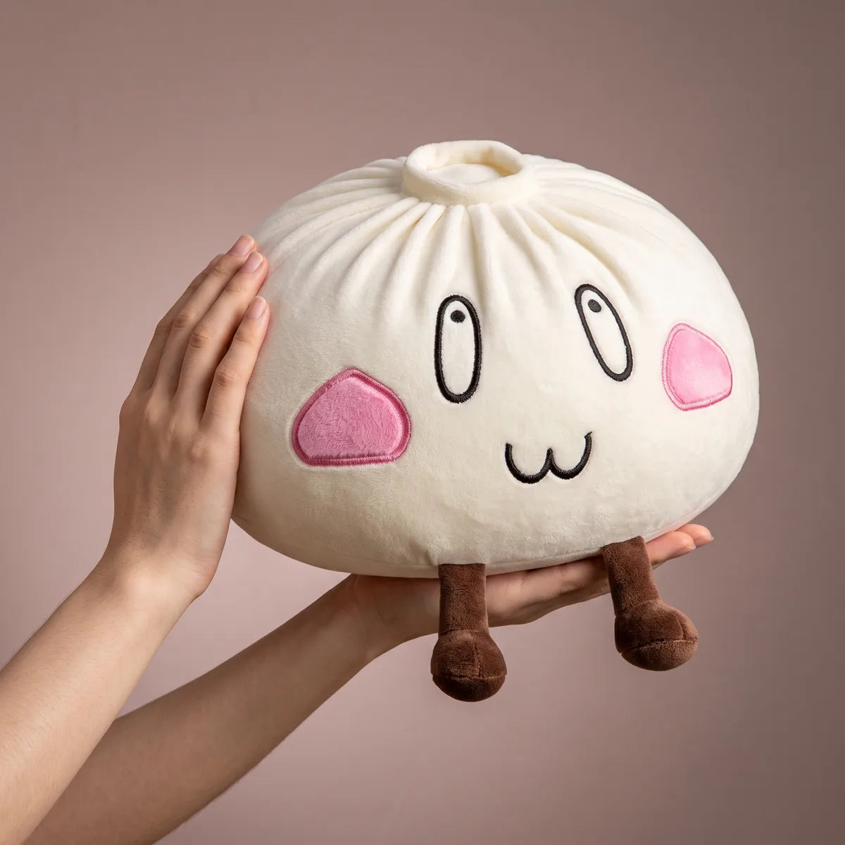 Giant Funny Happy Dumpling Squishy Plush held in two hands to show its giant size