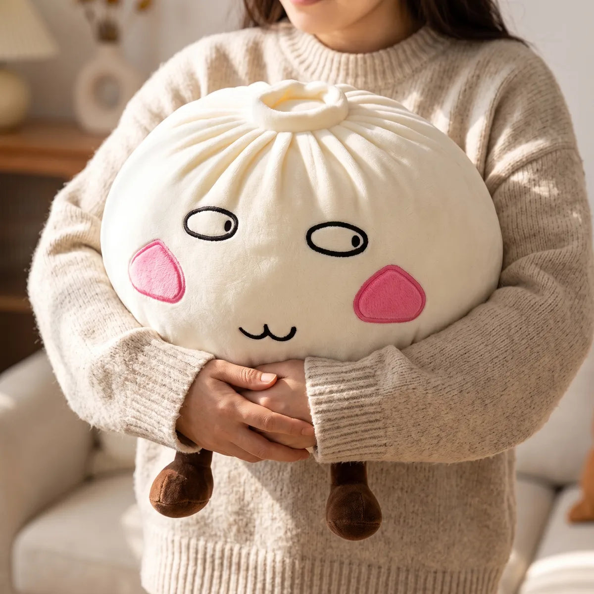 Person hugging the Giant Funny Proud Dumpling Squishy Plush against a soft sweater