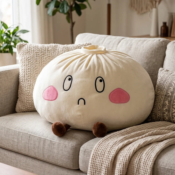 Giant Funny Sorrow Dumpling Squishy Plush sitting on a sofa as a cushion