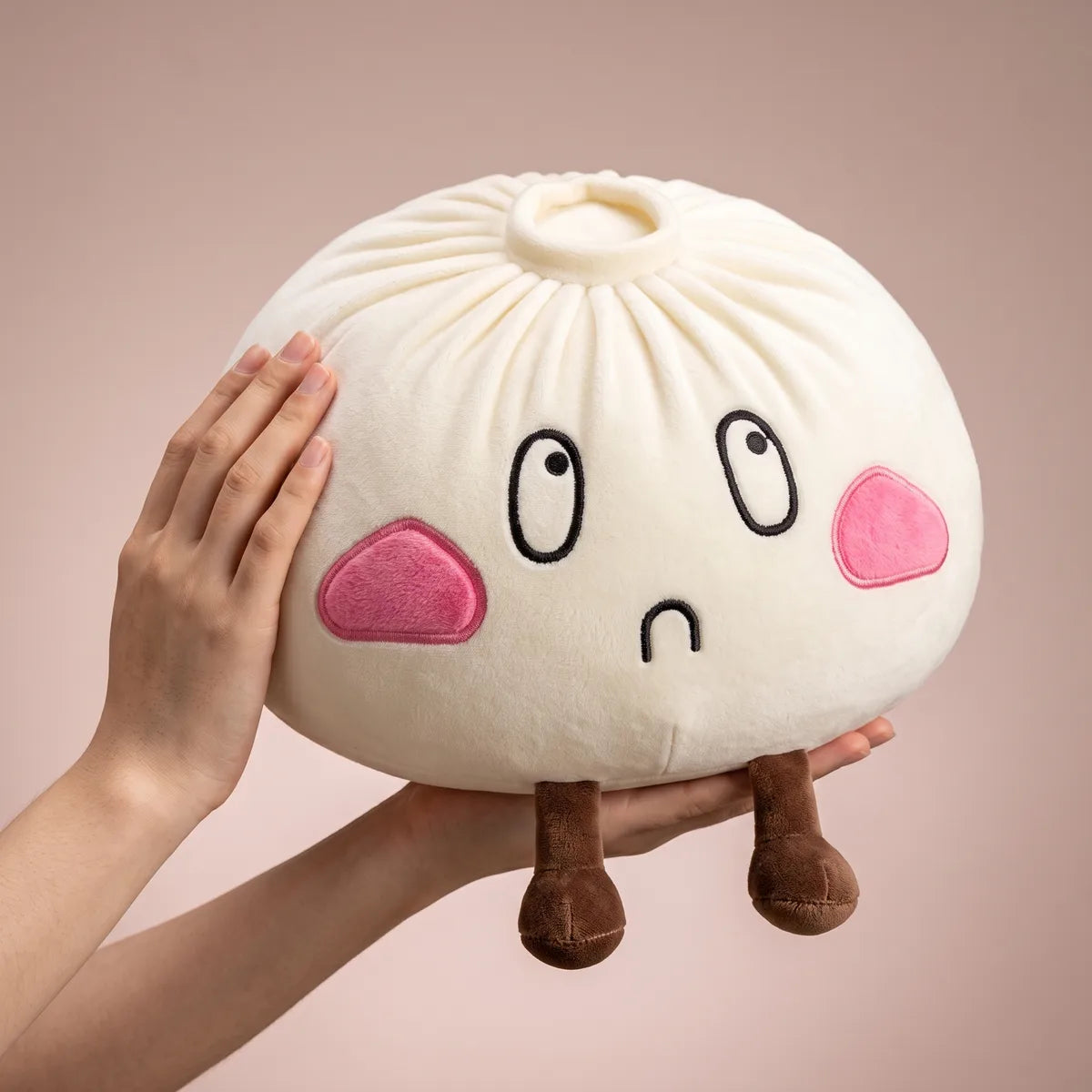 Giant Funny Sorrow Dumpling Squishy Plush held in two hands to show its giant size