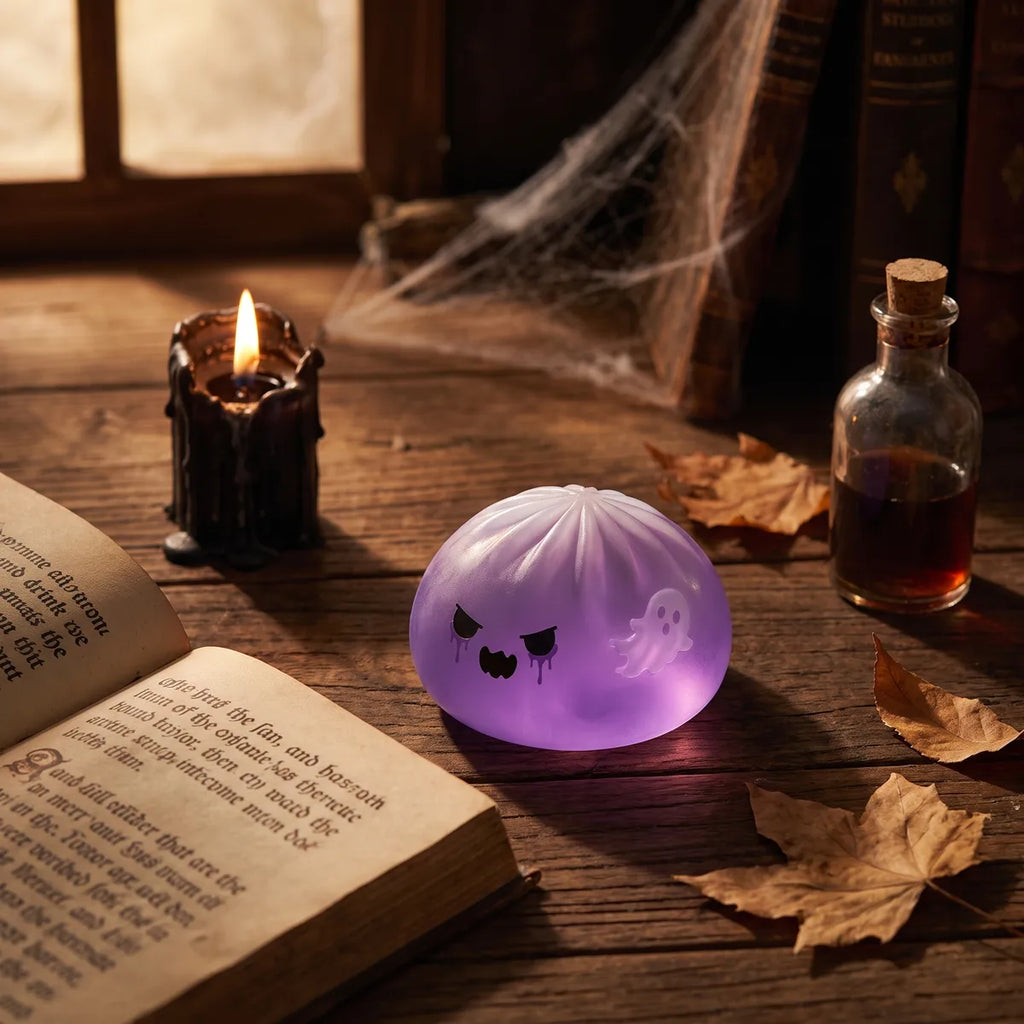 Ghost dumpling squishy styled in a spooky Halloween scene