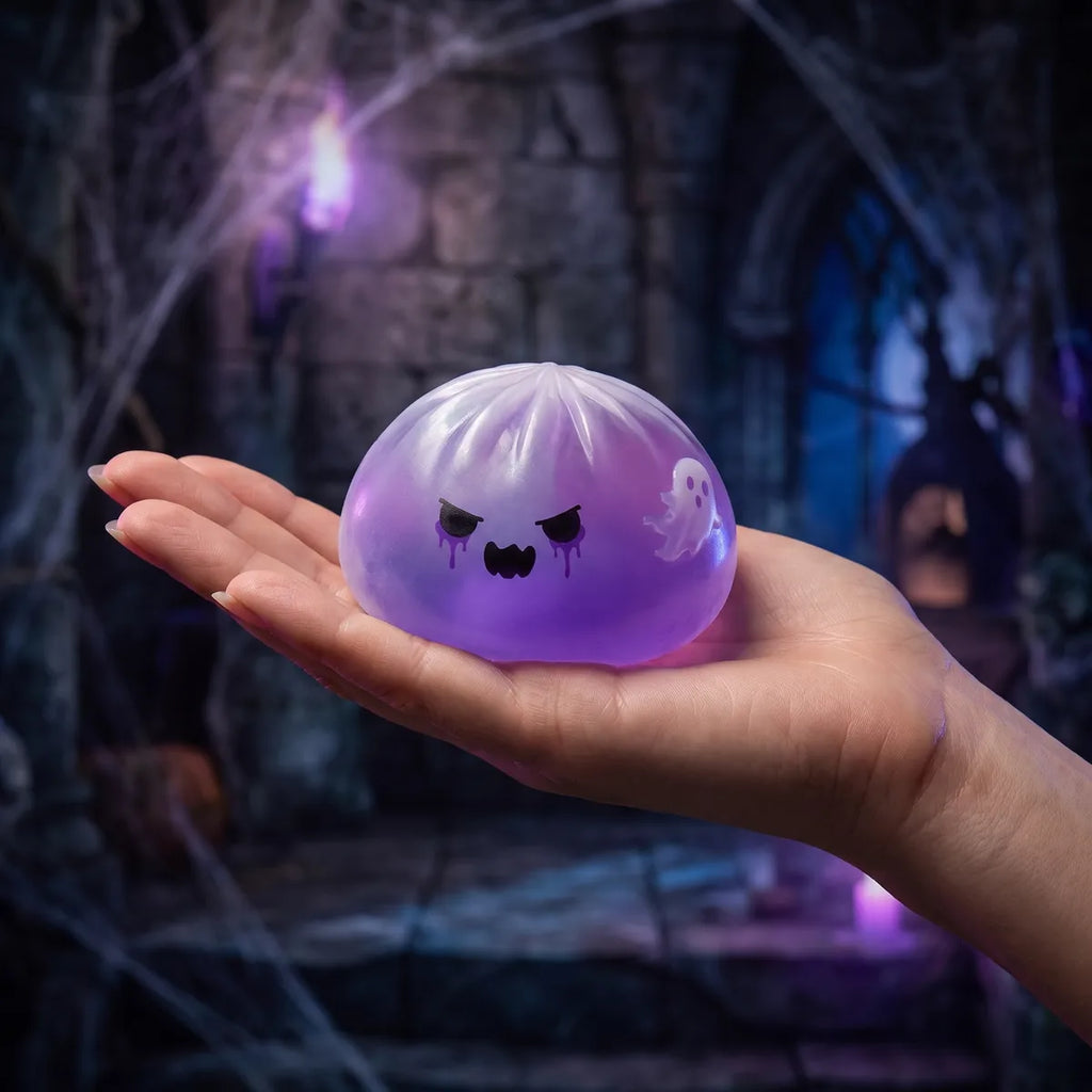 Hand holding a soft ghost dumpling squishy