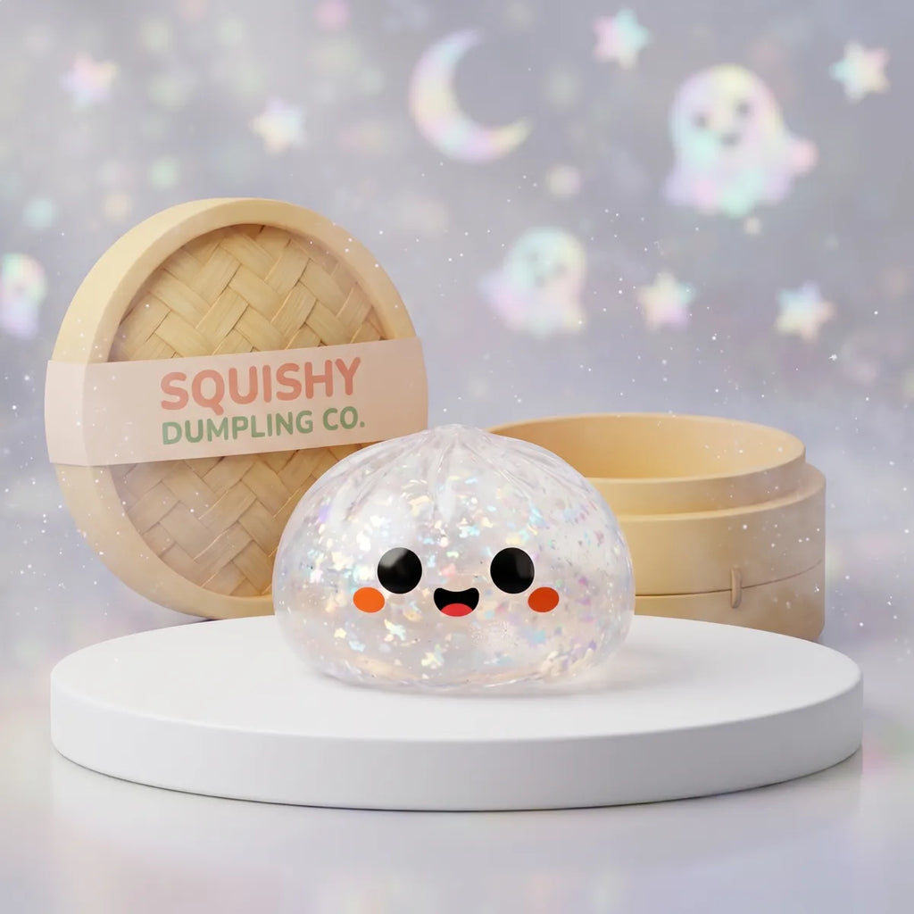 Clear iridescent glitter ghost Halloween dumpling squishy with a smiling face on a white podium
