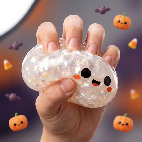 Close up squeeze showing the holographic silver flakes inside the ghost Halloween dumpling squishy