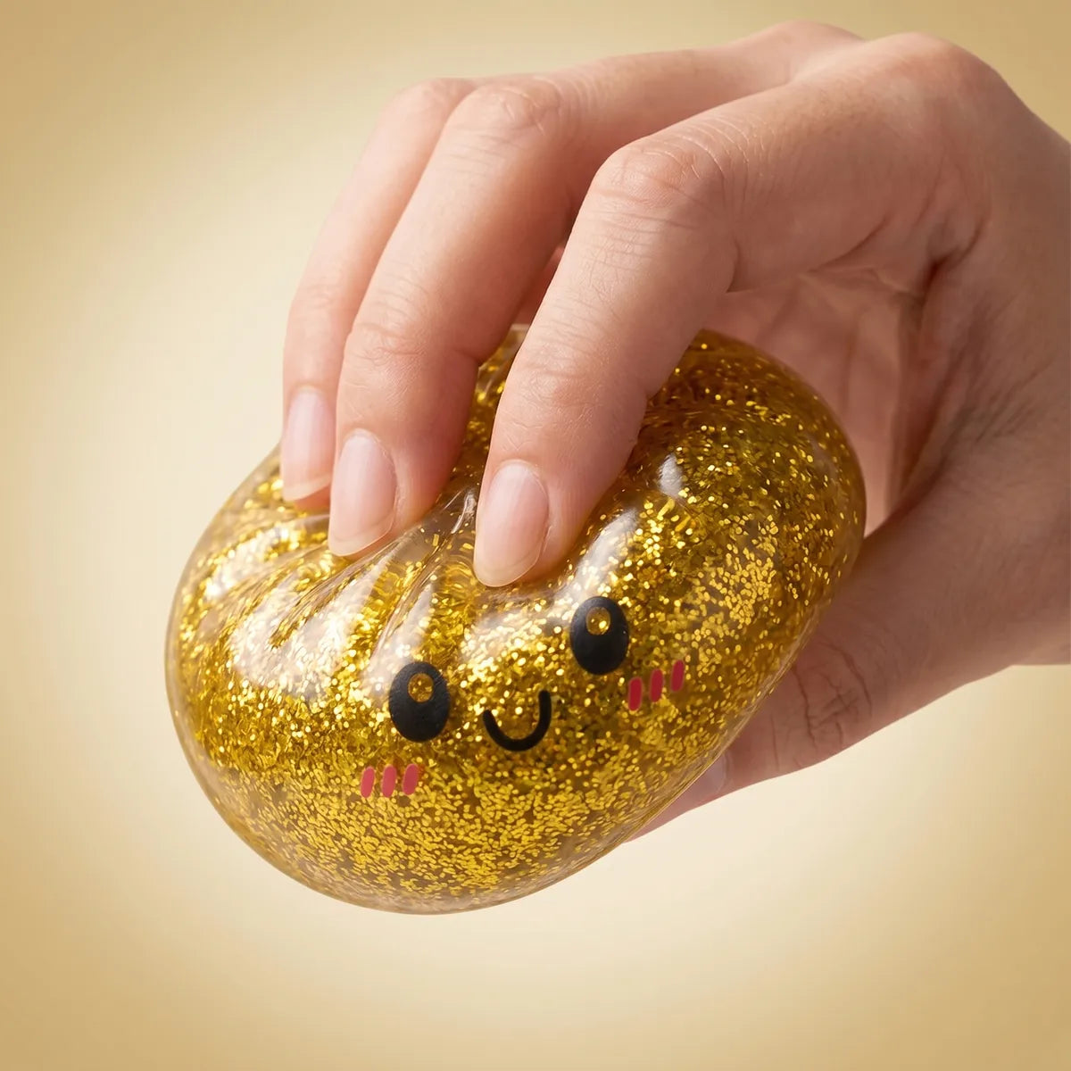 Hands playing with the glitter dumpling squishy set 6 pieces