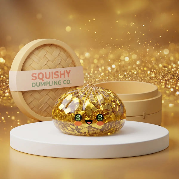 Gold Dumpling Squishy with a kawaii money-eyed face displayed beside a bamboo steamer