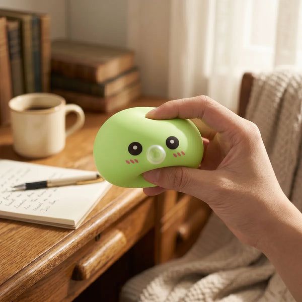 Green blow dumpling squishy styled as cute desk decor
