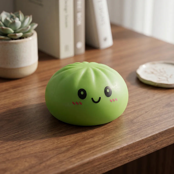 Green dumpling squishy displayed with bamboo steamer