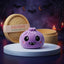 Velvet Halloween Vampire Dumpling Squishy Plush on a white studio podium beside a steamer basket