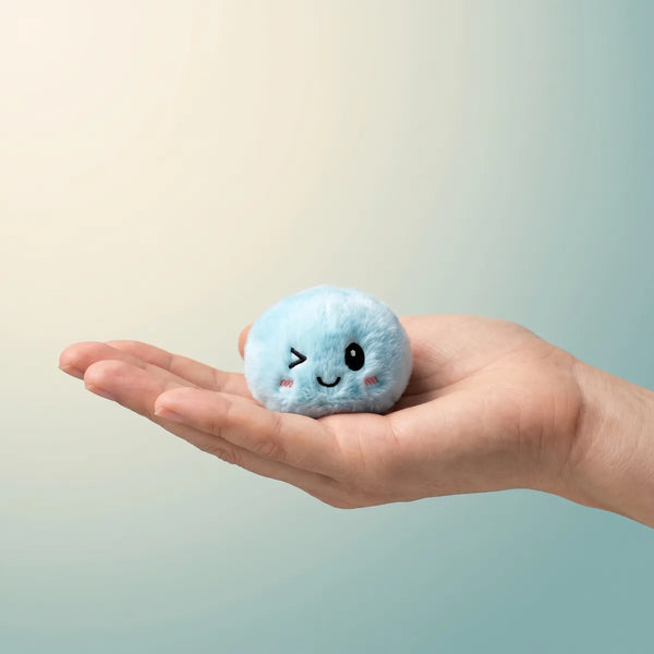 Keychain plush dumpling squishy held in hand lifestyle shot