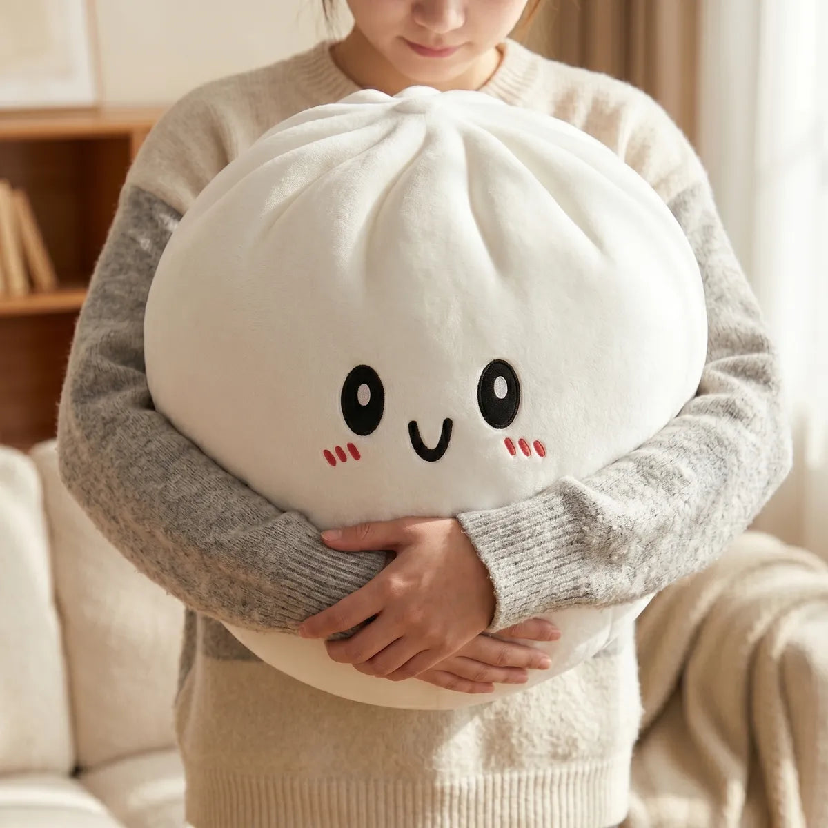 Person hugging the large dumpling squishy plush pillow