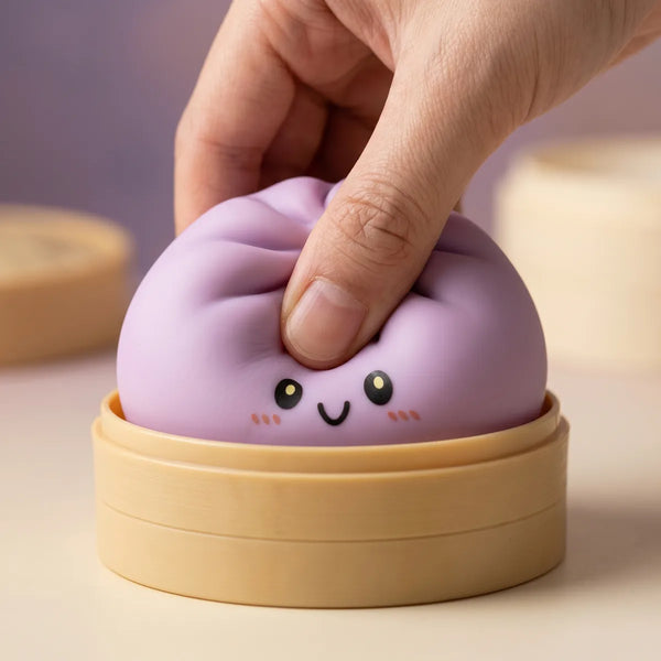 Magenta dumpling squishy being squeezed showing slow rising foam