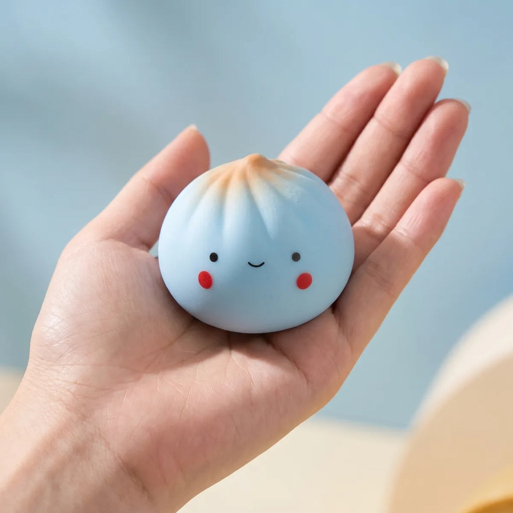 Mini dumpling squishy toy blind bag held in hand lifestyle shot