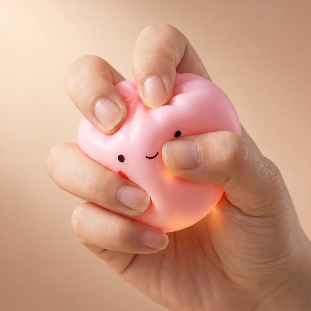 Hands playing with the mini dumpling squishy toy blind bag set