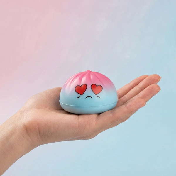 Mini dumpling squishy toy held in hand lifestyle shot