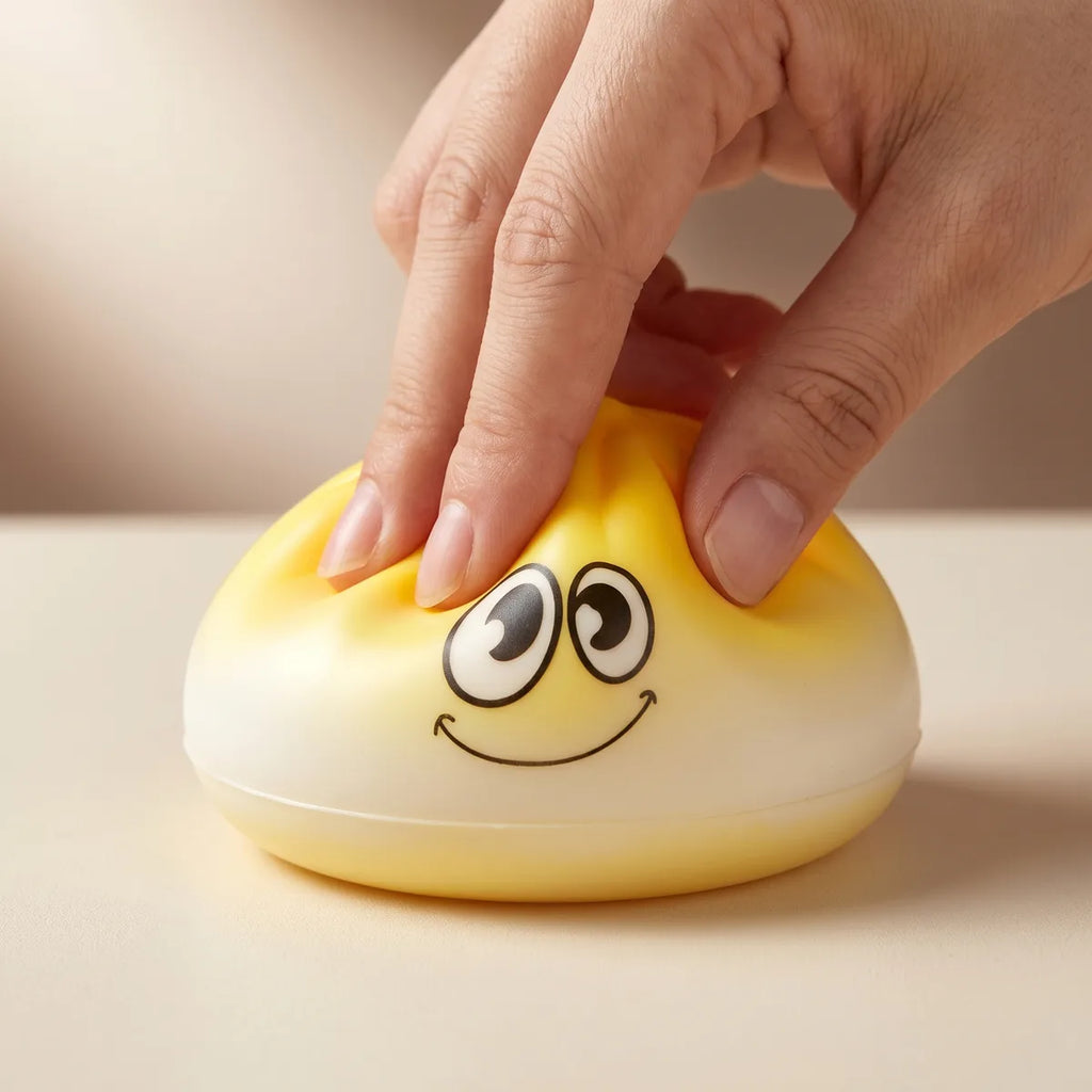 Mini dumpling squishy toy being squeezed showing slow rising foam