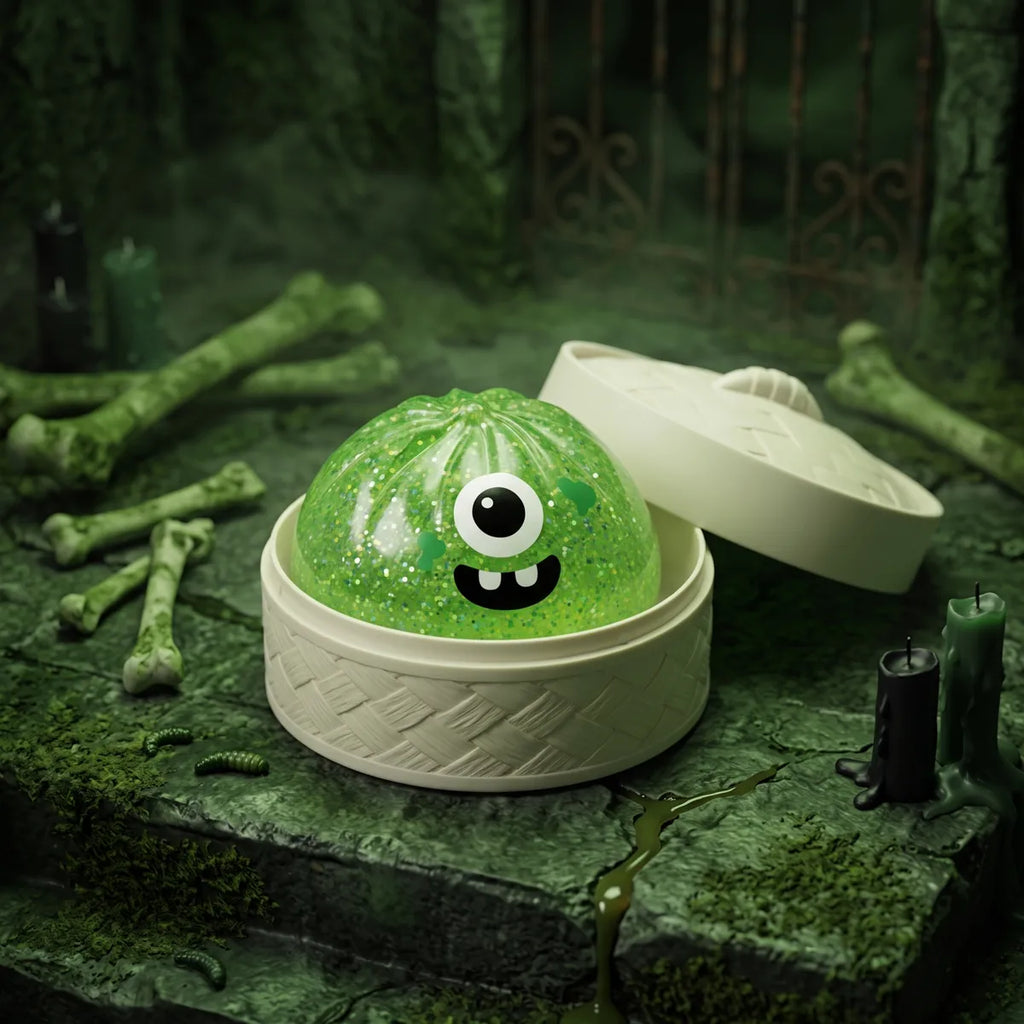 Monster Halloween dumpling squishy shown with its bamboo steamer style Halloween gift box