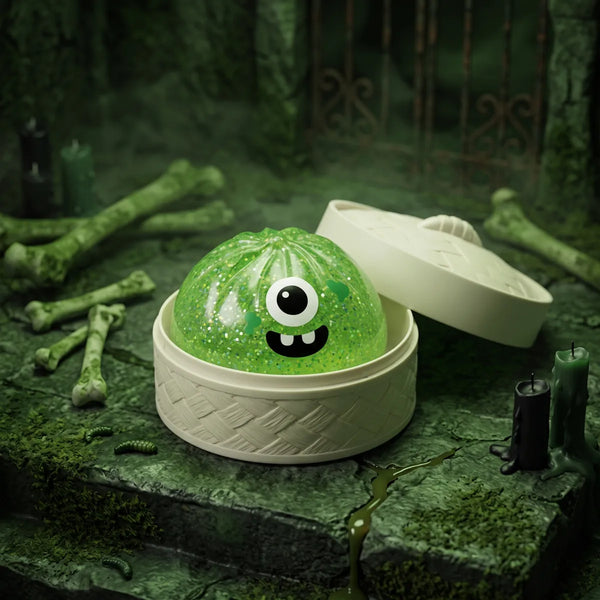 Monster Halloween dumpling squishy shown with its bamboo steamer style Halloween gift box