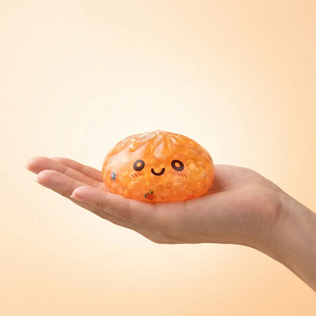 Mystery bubble dumpling squishy held in hand lifestyle shot