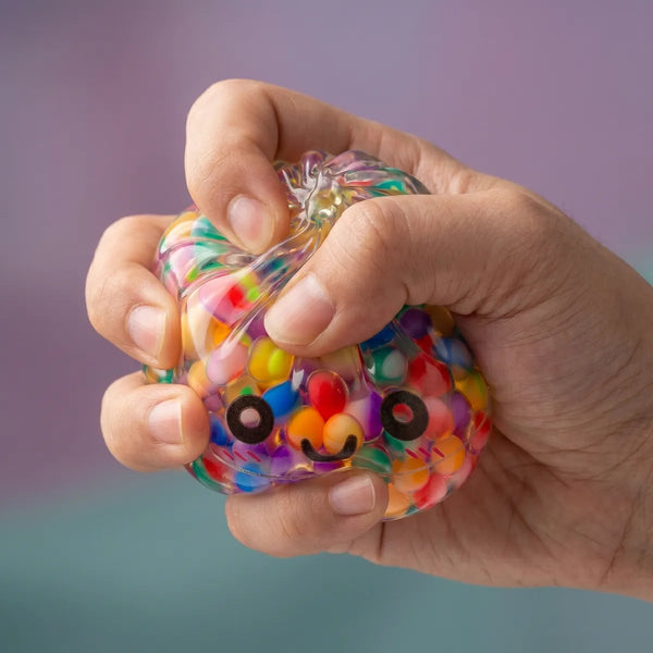 Hands playing with the mystery bubble dumpling squishy