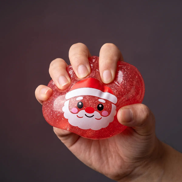 Hand squeezing the Sweet Mystery Candy Christmas Dumpling Squishy