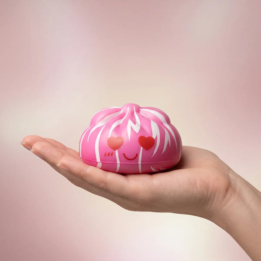 Hand holding an 8 cm mystery cute dumpling squishy to show its size