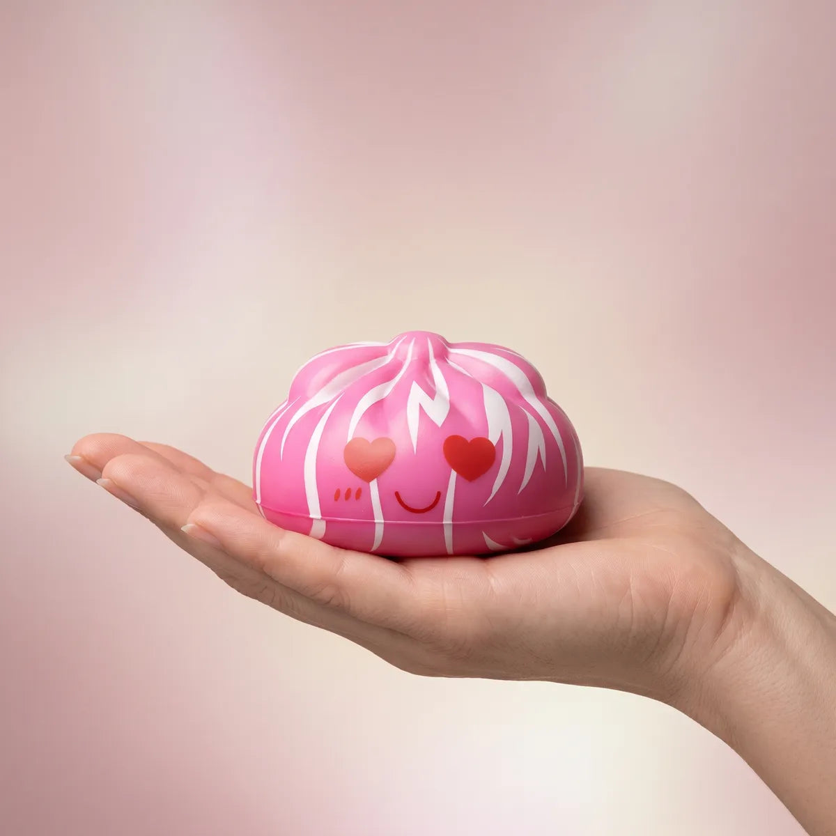 Hand holding an 8 cm mystery cute dumpling squishy to show its size