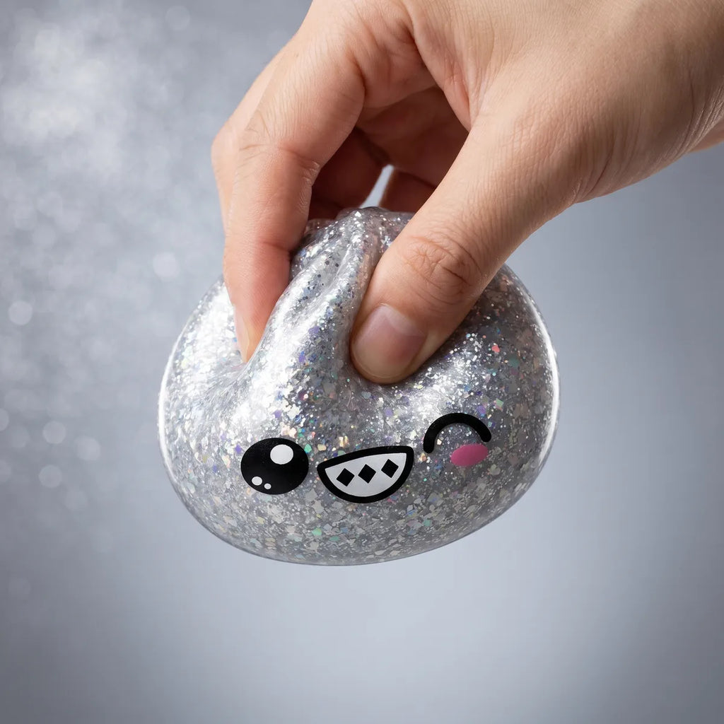 Hands playing with the rare mystery dumpling squishy