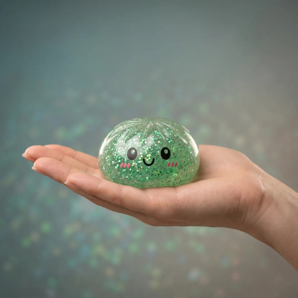 Mystery dumplings squishy glitter held in hand lifestyle shot
