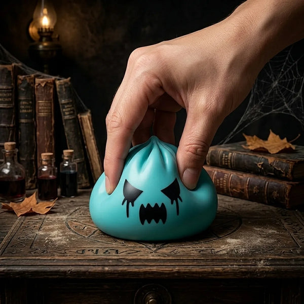 Hand squeezing a mystery ghost dumpling squishy to show its slow rise