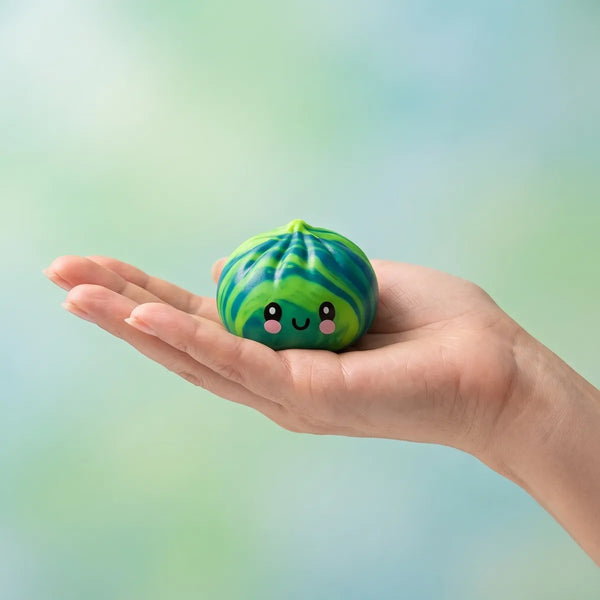 Hand holding a mini tie dye dumpling squishy