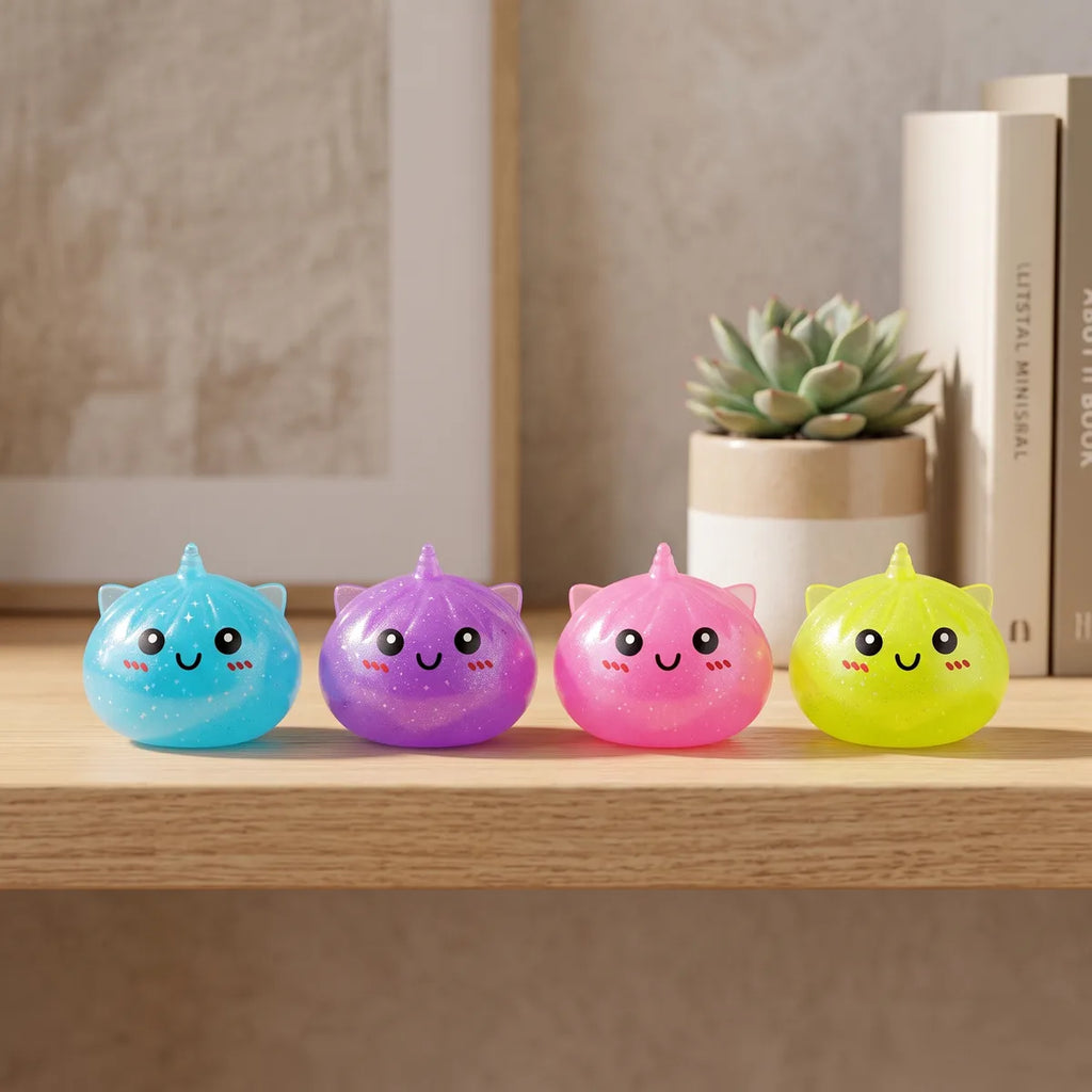 Mini unicorn dumpling squishies styled in a cozy lifestyle setting