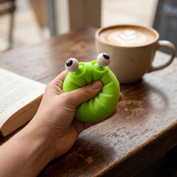 Person squeezing a mystery pop dumpling squishy as a silent classroom fidget