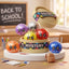 Mystery puppy eyed dumpling squishies spilling from a Mystery steamer box on a school desk